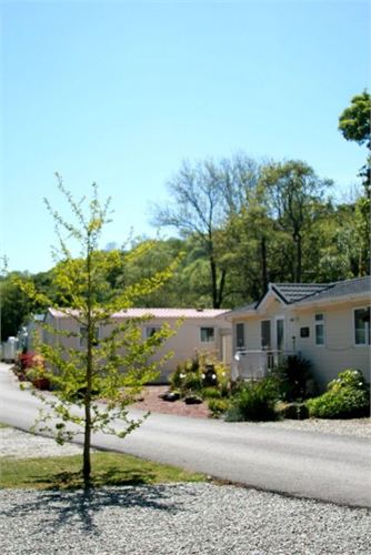 A luxury holiday lodge and holiday caravans at Notter Bridge
